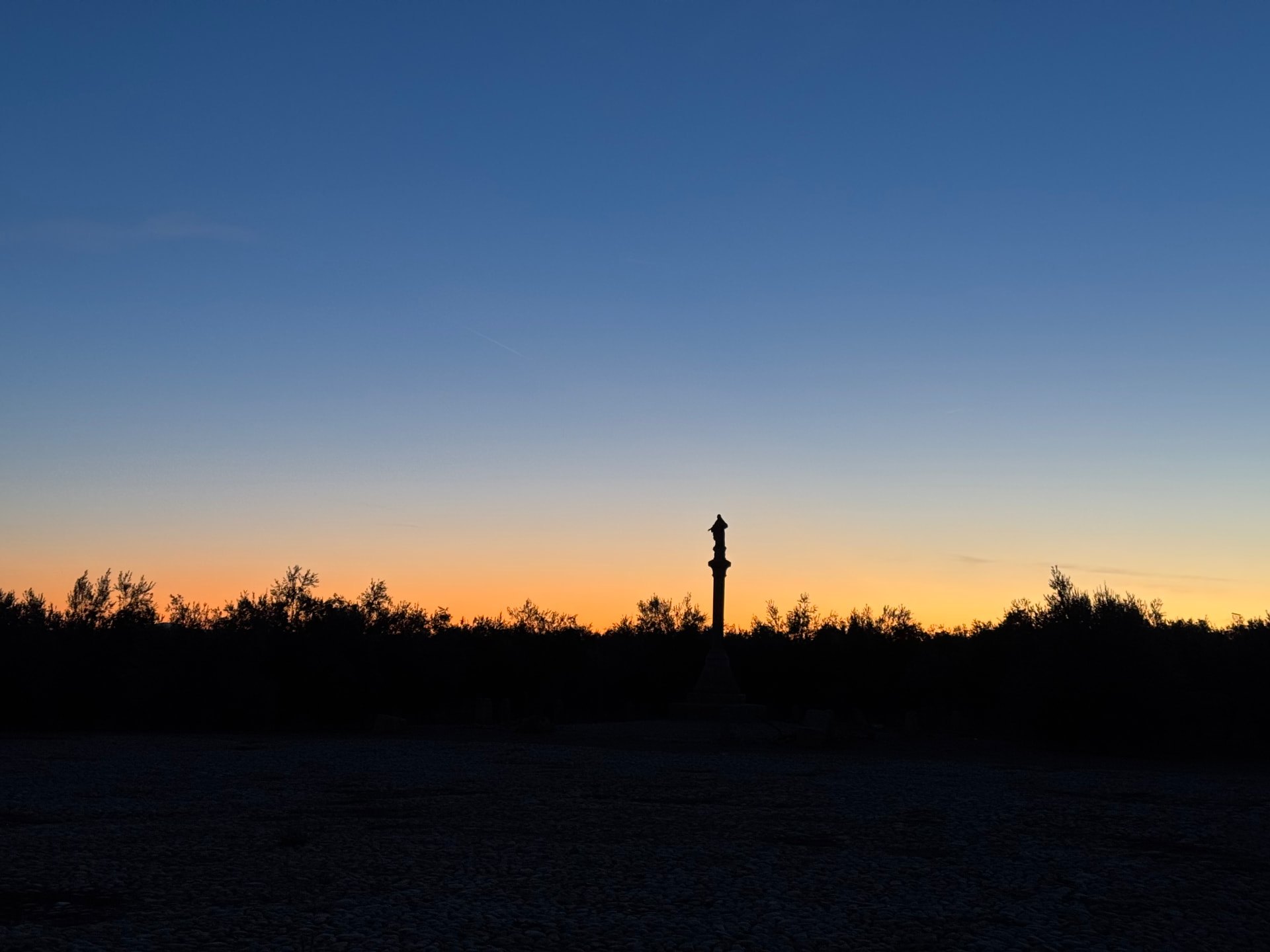 Silhouette against the sunset above the estate