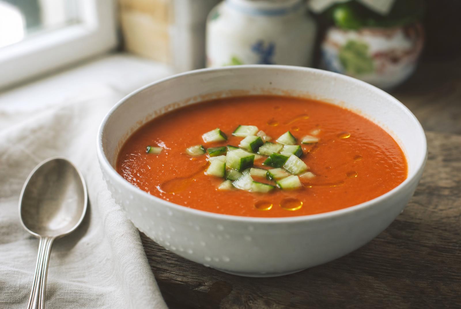 Bowl of chilled gazpacho andaluz finished with olive oil